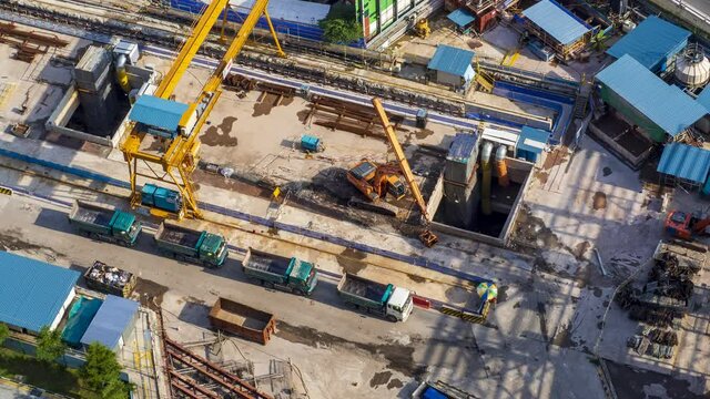4K Time lapse video of clamshell excavator digging the soil at Construction site. 