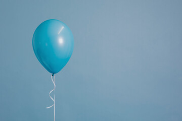 Blue single balloon with a string