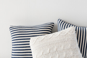 Striped and knitted cushions