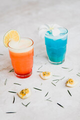 tropical fruity cocktails on a concrete background