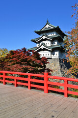 Hirosaki Castle and Japanese old bridge style in the Autumn season of Hirosaki city, Japan.