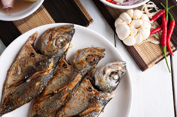 Deep fried mackerel with fish sauce, Traditional Thai food.