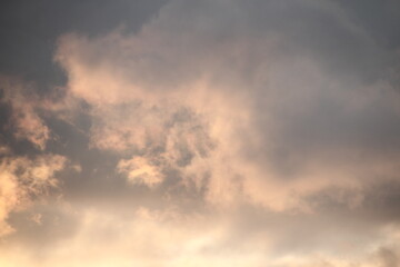 Obraz premium Clouds, in the rays of the setting sun.