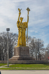 the Statue of the Republic under a clear blue sky in winter in Jackson Park, Chicago, IL.