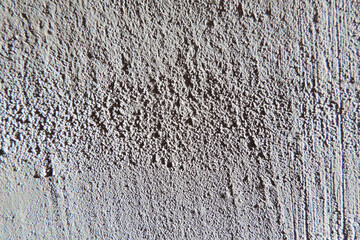 Grungy texture of gray plaster made from  mixture of concrete, cement and small stones. wall texture background.    