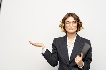 Woman in business suit finances work documents glasses hairstyle