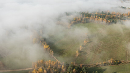 Landscape with fog and hills on an epic autumn morning
