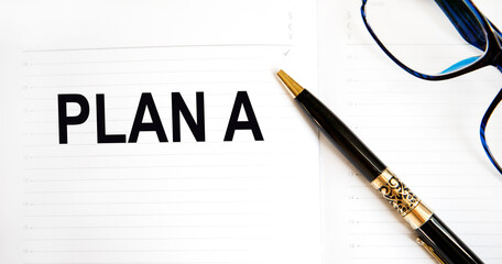 In the diary text PLAN A, next to the pen, glasses.