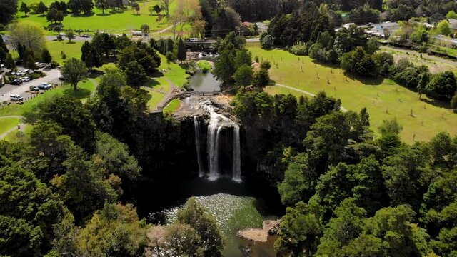 Whangarei Falls famous tourist spot in Northland, New Zealand. Aerial birds eye view. Beautiful sunny day