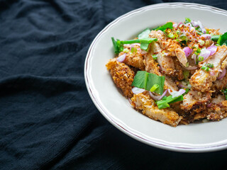 Thai food Spicy Chicken Salad is a favorite of locals in Thailand. You can find it in the street food stalls. Using fried chicken as a staple