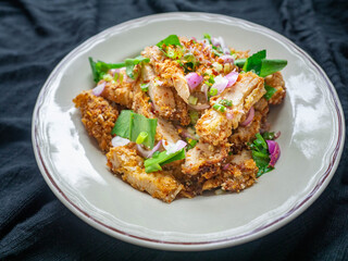 Thai food Spicy Chicken Salad is a favorite of locals in Thailand. You can find it in the street food stalls. Using fried chicken as a staple