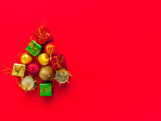 Christmas tree decorations, gift boxes, ball drop.On a red background To beautify the Christmas tree