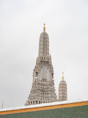 The interior of Wat Arun shows the work of Thai architecture on a rainy day, the sky is gray. Location: Bangkok, Thailand