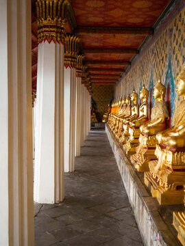 In the inner hallway of Wat Arun, there is a Buddha image on the side of the wall showing the Thai architecture assembly work. Location: Bangkok, Thailand