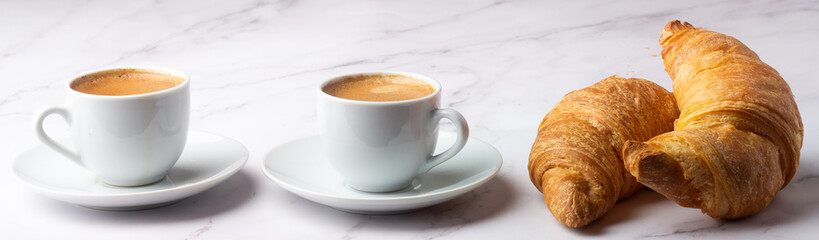 breakfast black coffee and croissants on white background stretching.