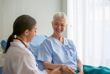 Fototapeta premium doctor and patient, Female doctor doing medical exam to a senior woman