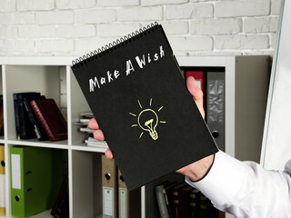 Business concept about  Make A Wish    with inscription on the page.