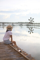 Asian women and salt farm, Ban Laem, Phetchaburi Province, Thailand