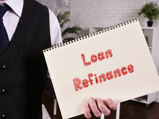Business concept meaning Loan Refinance with sign on the page.