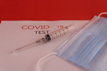 A syringe and a mask blue
