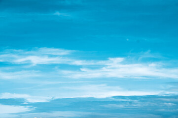 Naklejka na ściany i meble Beautiful blue sky background with clouds