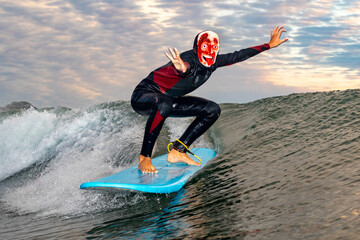 Halloween Costume Surfing Various scary costumes worn by a surfer while riding waves in Japan. Pumpkin, Monster, clown, witch. The waves are clean with a good looking sunrise as well