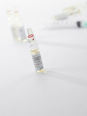 Close up view of the ampules with medicine on white back 