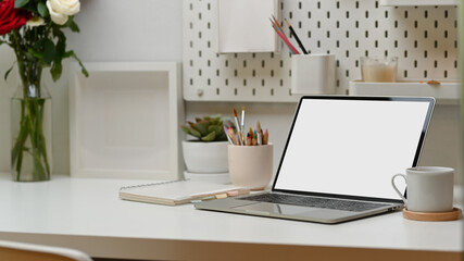 Workspace, laptop, supplies, decorations and copy space in home office, clipping path