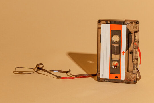 Old school cassette tape on a beige background