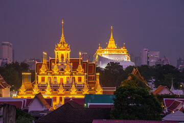Beautiful Bangkok cityscape at twilight with Loha Prasat Wat Ratchanatda and Golden Mountain pagoda  during twilight time, Bangkok, Thailand.