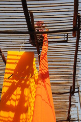 orange fabric, textile Industry , rural Rajasthan, India	