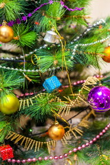 Christmas artificial tree decorated with toys