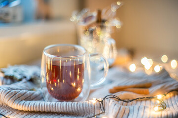 Christmas card with chrismas ligh. Soft focus. Cup with lights. Chrismas and New Year background. Flat lay