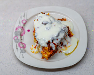 Traditional Turkish Food Kayseri Yalama with Minced Meat, Yogurt and Tomato Paste