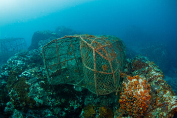 Fish Trap lying Underwater at the bottom of the big blue sea.One of traditional fishing techniques in undeveloped areas.