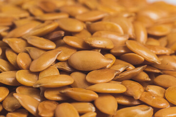 Macro photograph of golden linen, a close-up of golden linen, golden linen seed