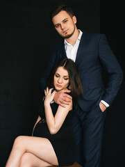 pregnant couple hugging. Lovers fashionable young man and woman