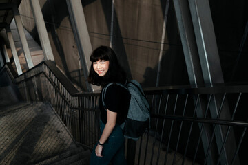 Pretty urban woman walking on the street.
