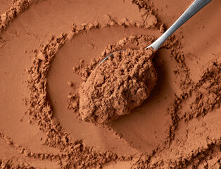 spoon of cocoa powder