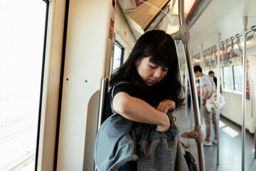 Thai woman travel by a train in Bangkok.