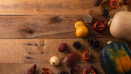 Autumn decoration banner with close-up view of harvest. Concept of thanksgiving day. Flat lay. Rustic wooden background.
