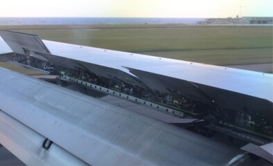 interesting image of the wing of a 737 aircraft during the landing phase with the flaps open
