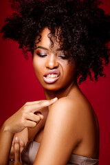 Emotional dark-skinned girl. Beautiful African American woman with a beautiful hairstyle