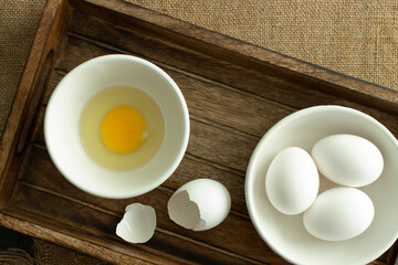 Eggs, broken egg in wooden box