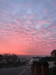 Red and orange cloud formations at sunrise in Rochester, Kent, United Kingdom