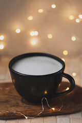 Sweet hot cocoa on wood table, closeup