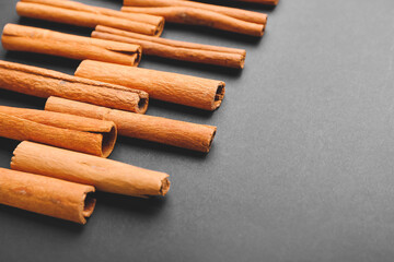 Cinnamon sticks on grey background