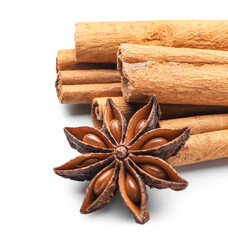Cinnamon sticks and anise on white background, closeup