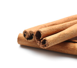 Cinnamon sticks on white background, closeup