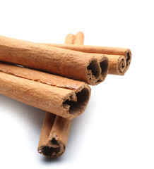 Cinnamon sticks on white background, closeup